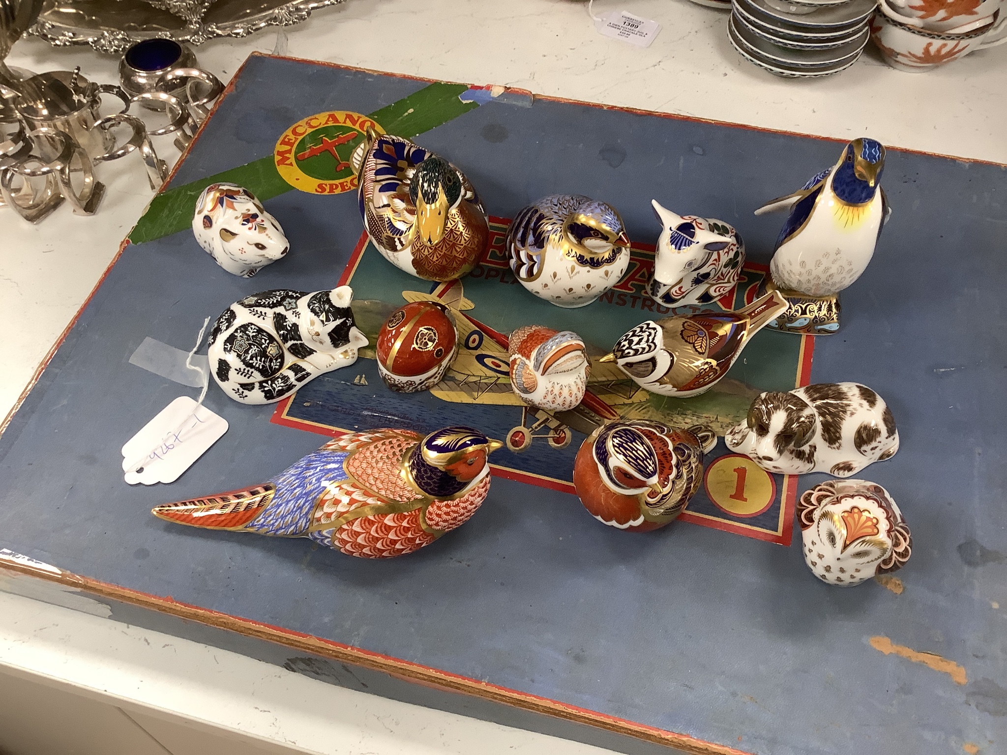 Approximately thirty-two Royal Crown Derby Imari porcelain paperweights, all but two with original boxes and mostly gold bottoms